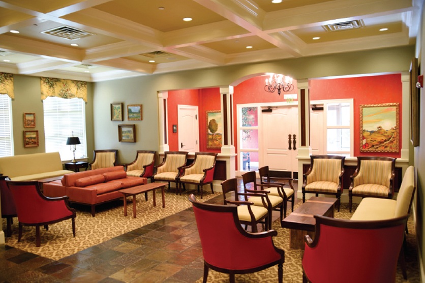 Spacious office waiting area with multiple couches and chairs