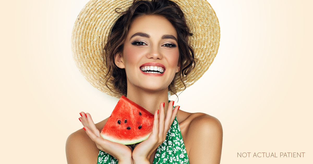 An advertisement image for summer specials at Southeastern Plastic Surgery, P.A.. The image features a woman holding a slice of watermelon.