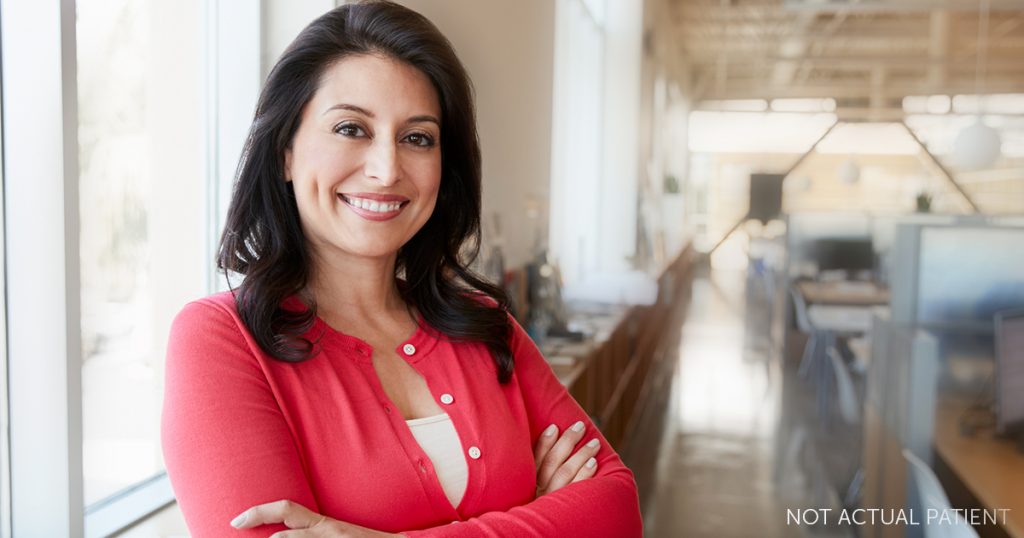 Woman smiling and happy about her figure (NOT ACTUAL PATIENT)