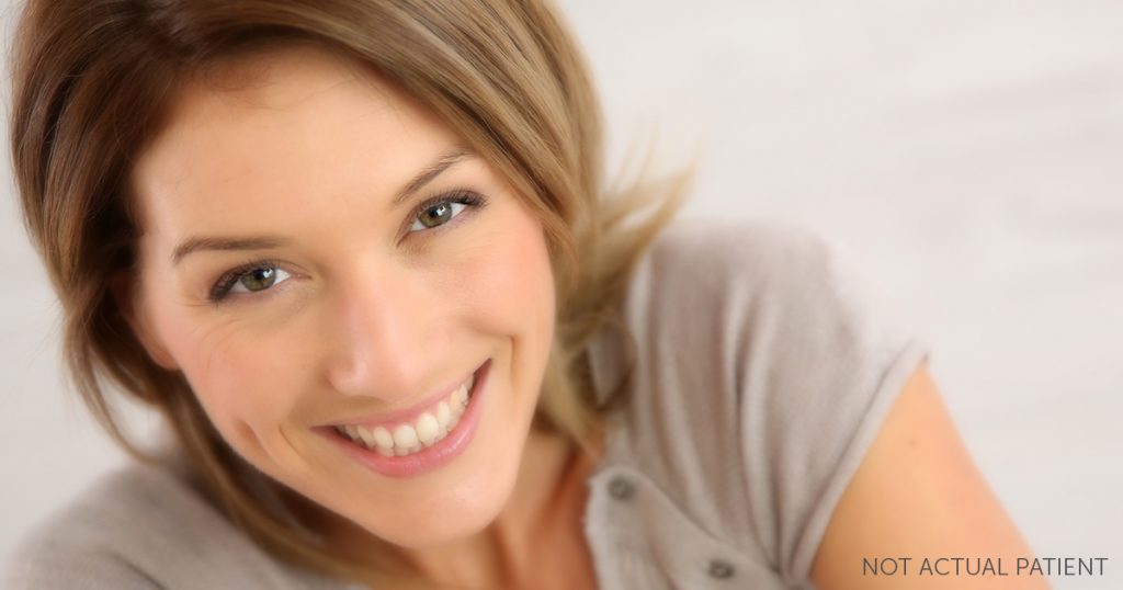 Woman proudly displaying her youthful facial features