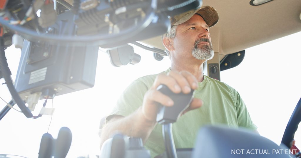 Middle aged man driving a truck